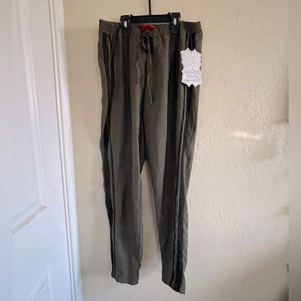Khaki pants with black stripes on sides.  Sexy military style